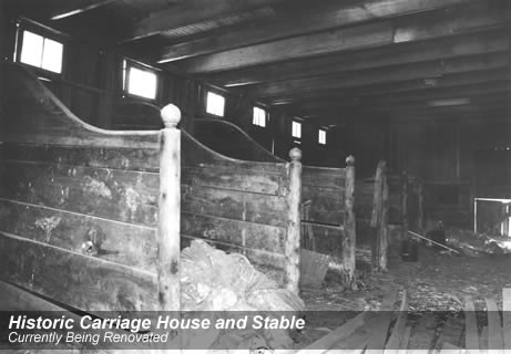 Horse stalls in the stable/carriage house before restoration